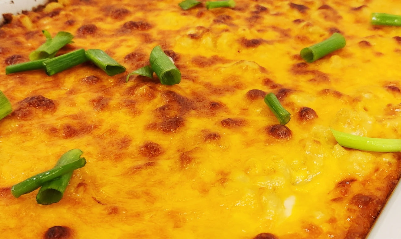 Golden bubbly baked mac and cheese topped with fresh green onions